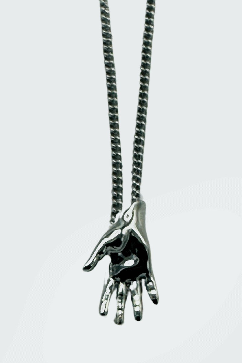 Dirty Pineapple EmojiHands pendant necklace gold Waving figure close up