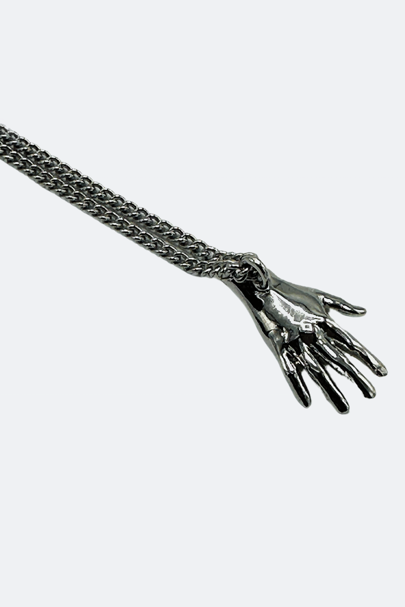 Dirty Pineapple EmojiHands pendant necklace gold Waving figure close up