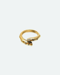 Gold ring with a unique design of a human finger shape on a white background