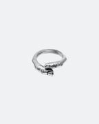 Silver ring with a unique design of a human finger shape on a white background