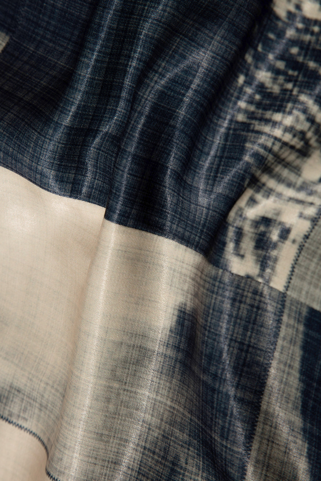 Close up of blazer with body patchwork design in creamy yellow