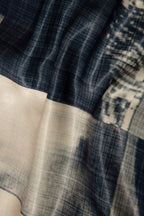 Close up of blazer with body patchwork design in creamy yellow