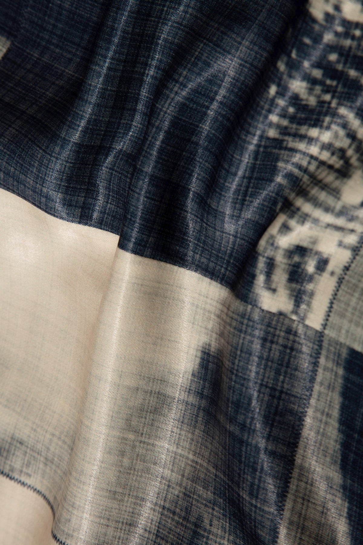 Close up of blazer with body patchwork design in creamy yellow