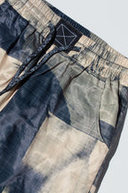 Close up of suitpants with body patchwork design in creamy yellow