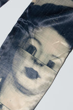 Close up of suitpants with body patchwork design in creamy yellow