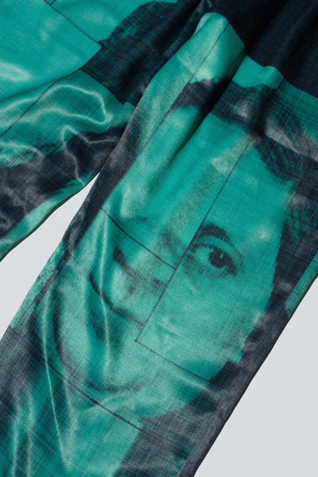 Close up of suitpants with body patchwork design in green