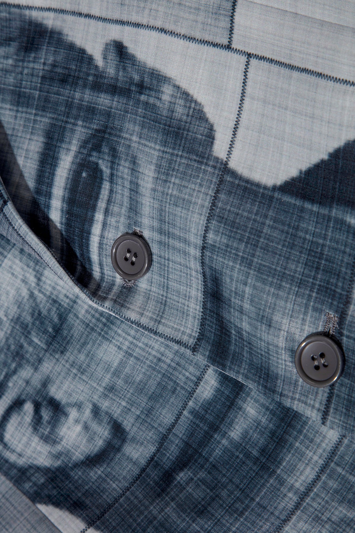 Close up of blazer with body patchwork design in grey