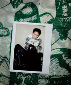 Model wearing a green and white butterfly patterned long sleeve top