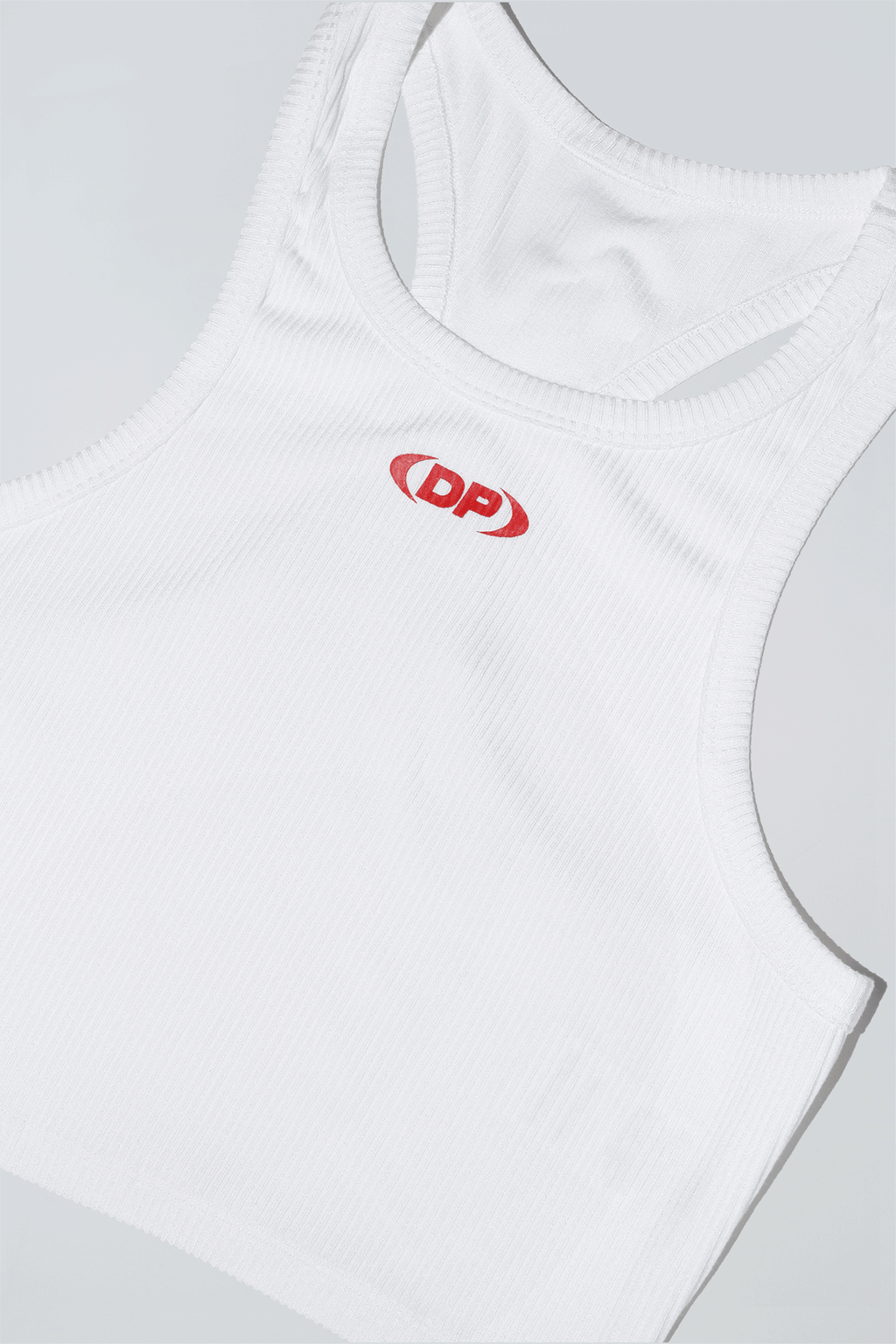 White tank top with a red logo on a light gray background