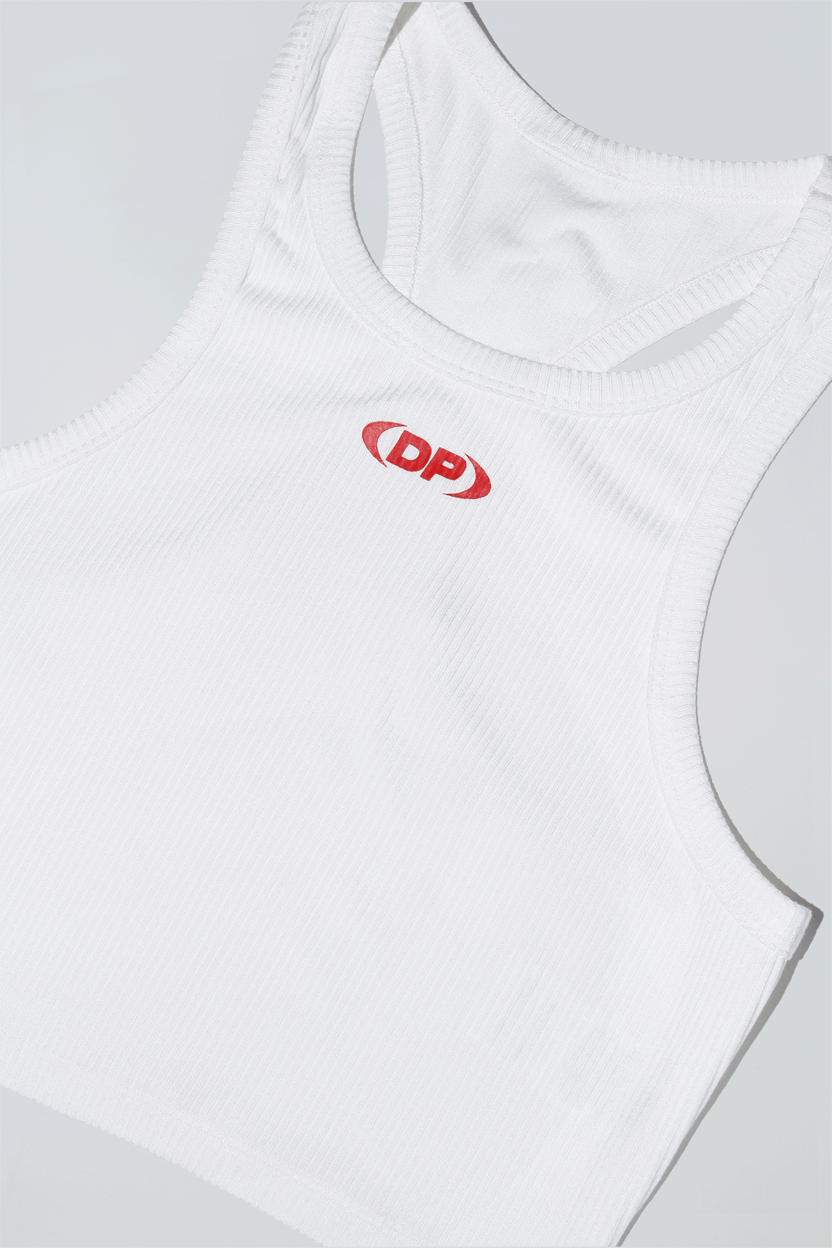 White tank top with a red logo on a light gray background