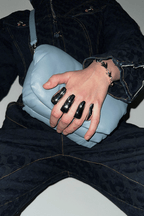 Person holding a light blue handbag