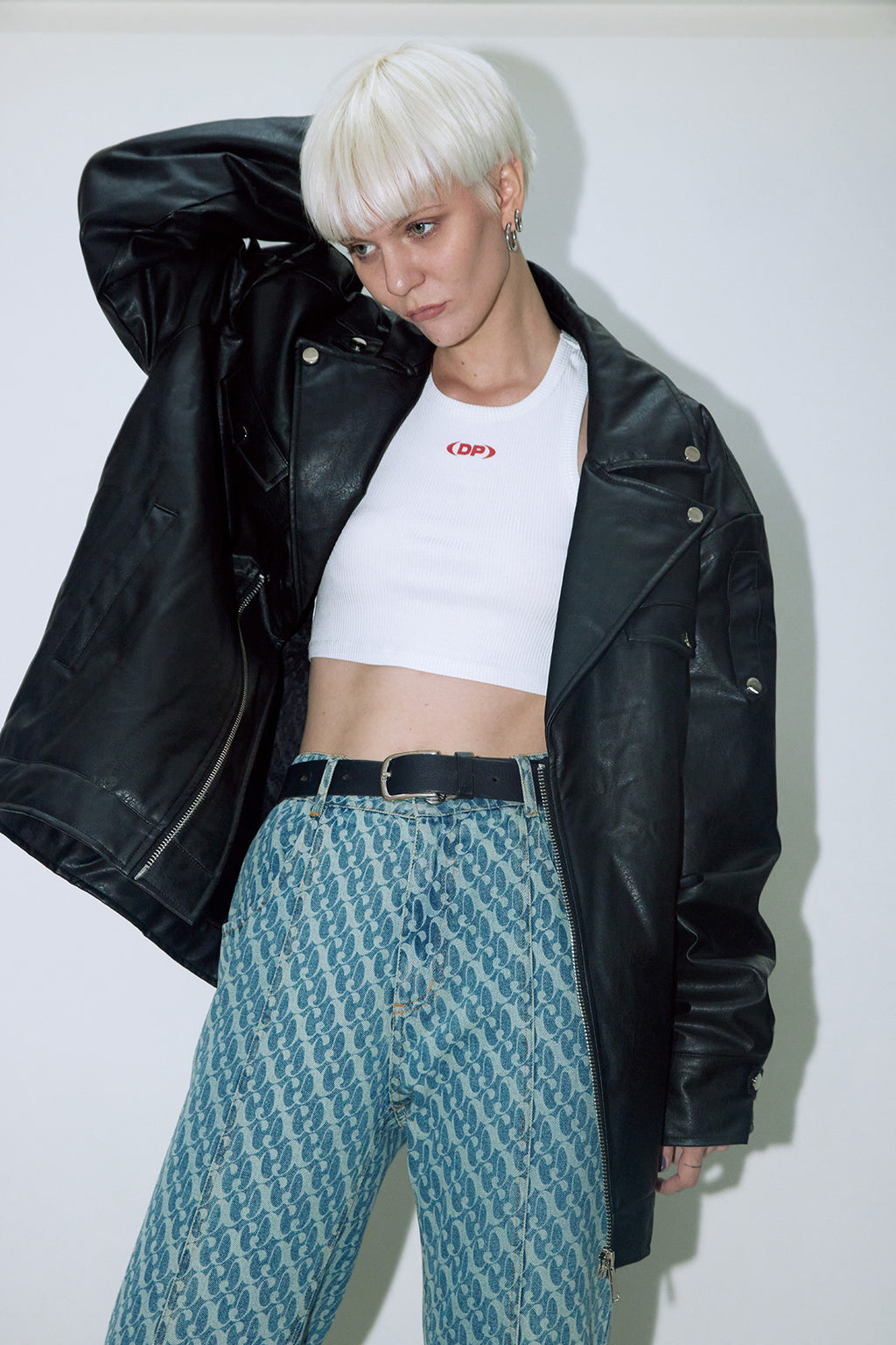 Model wearing Dirty Pineapple leather biker jacket over white background