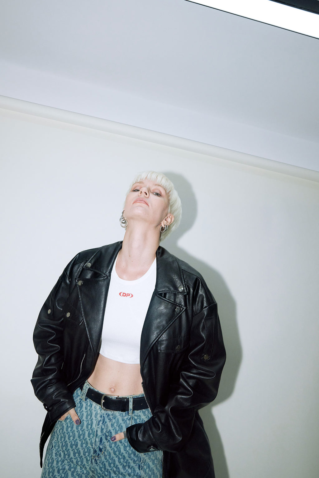 Model wearing Dirty Pineapple leather biker jacket over white background