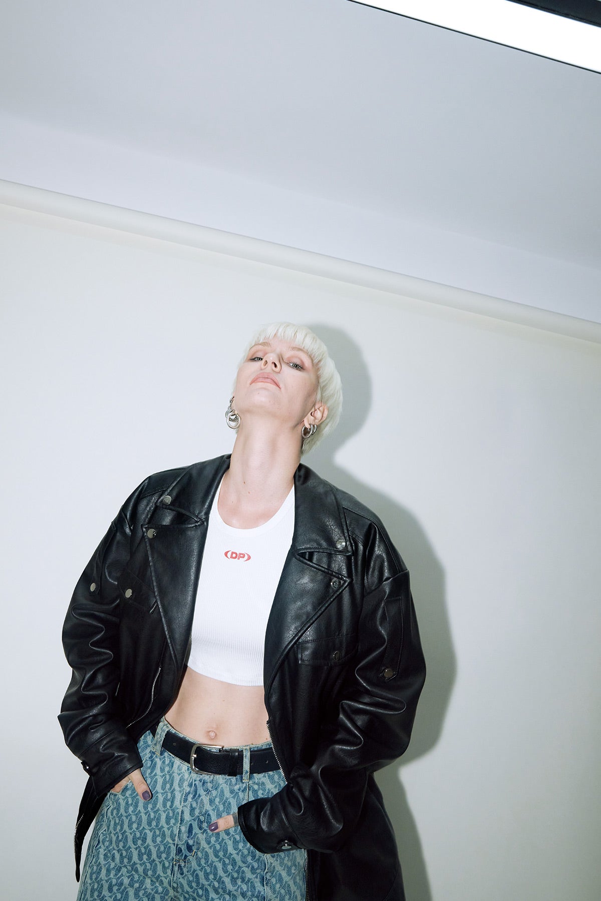 Model wearing Dirty Pineapple leather biker jacket over white background