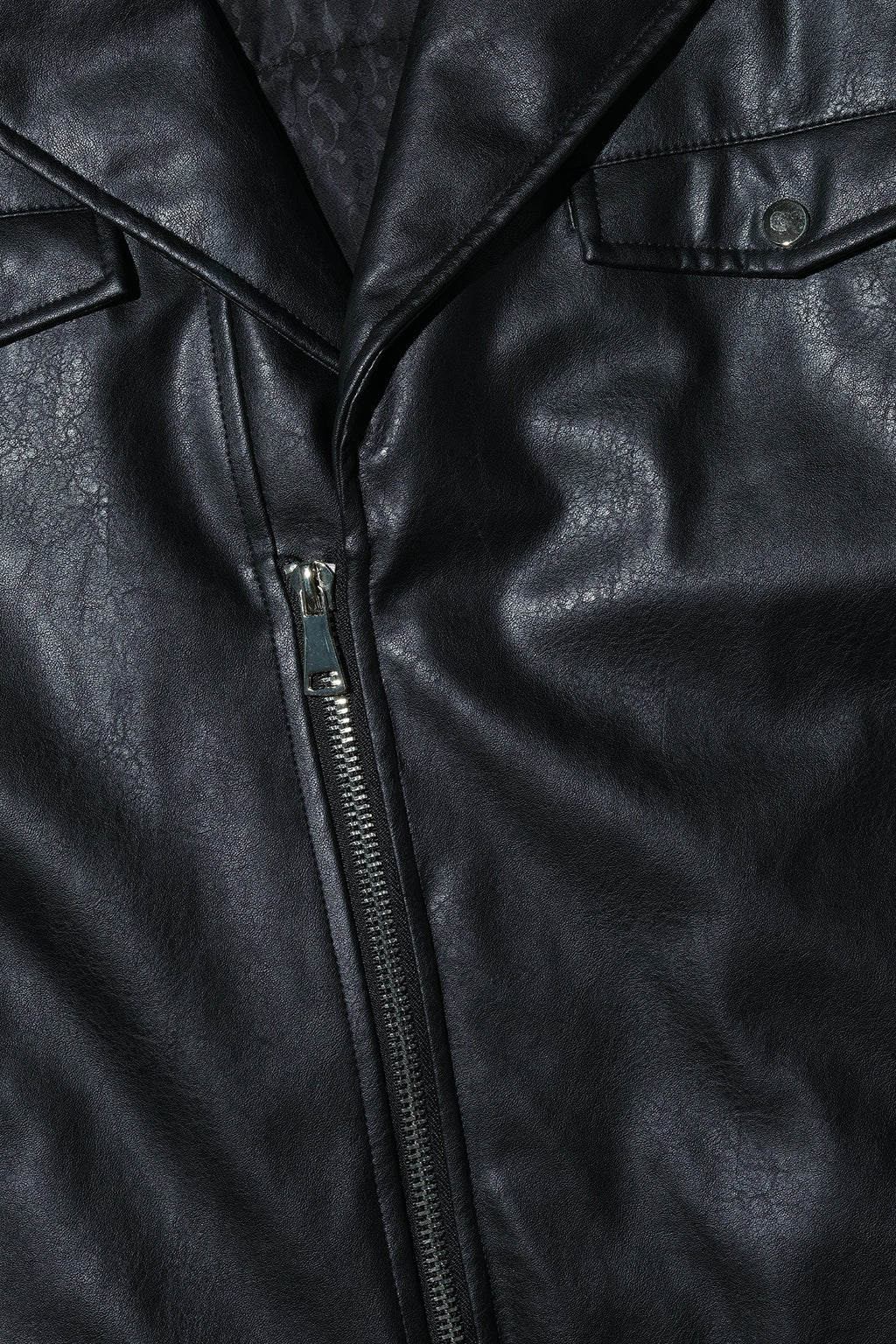 Close up of Dirty Pineapple leather biker jacket fabric