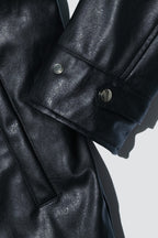 Close up of Dirty Pineapple leather biker jacket over white background