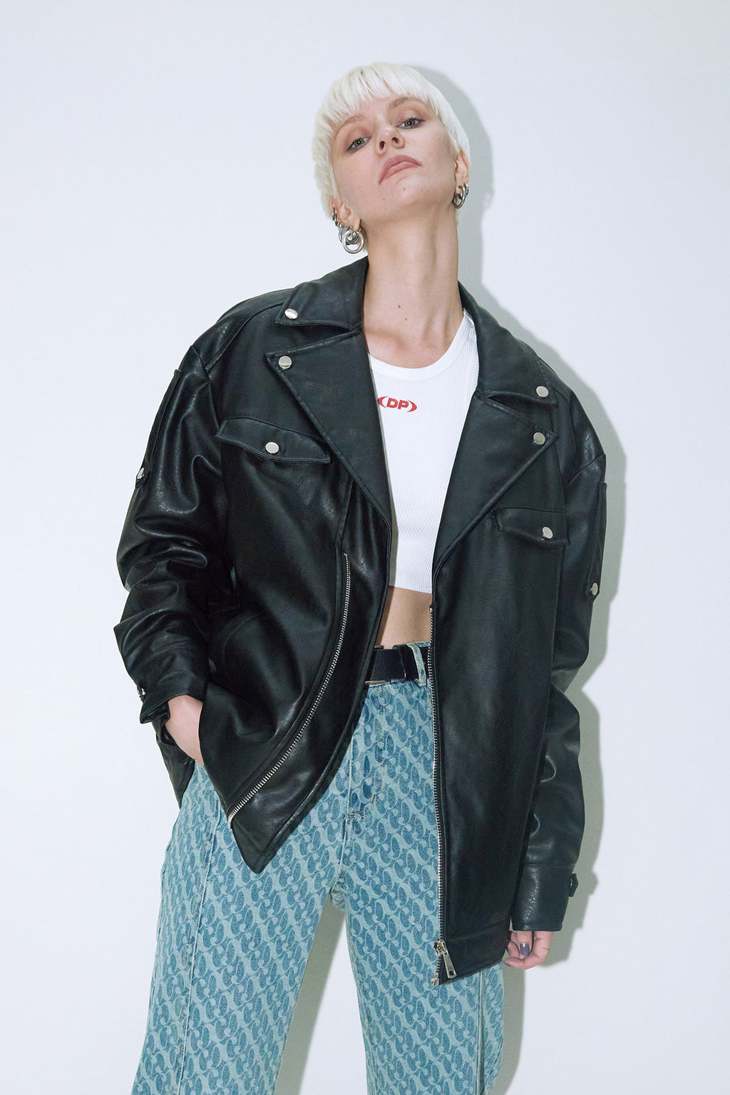 Model wearing Dirty Pineapple leather biker jacket over white background