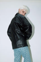 Model wearing Dirty Pineapple leather biker jacket over white background