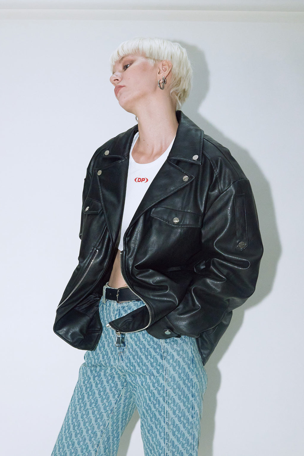 Model wearing Dirty Pineapple leather biker jacket over white background