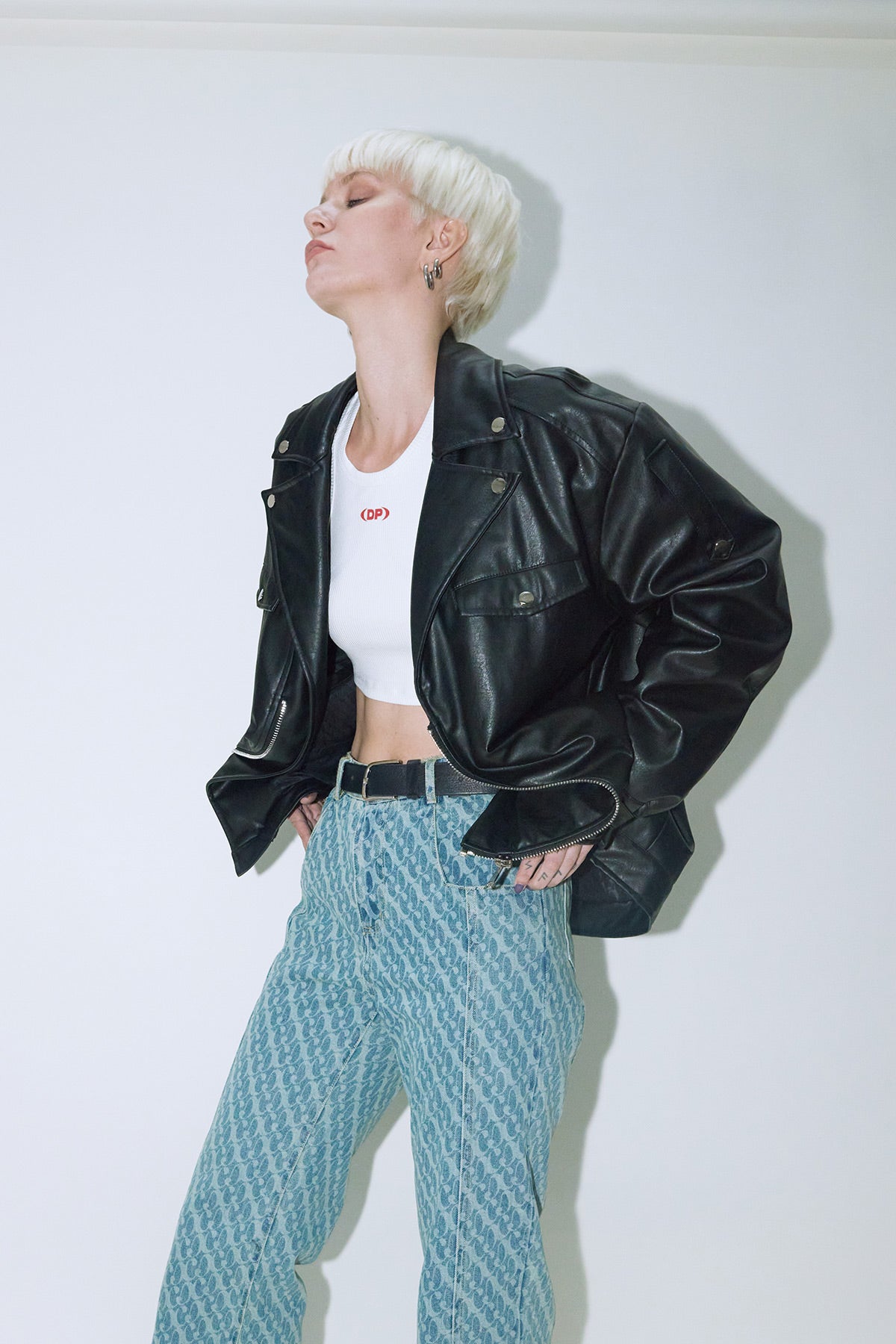 Model wearing Dirty Pineapple leather biker jacket over white background
