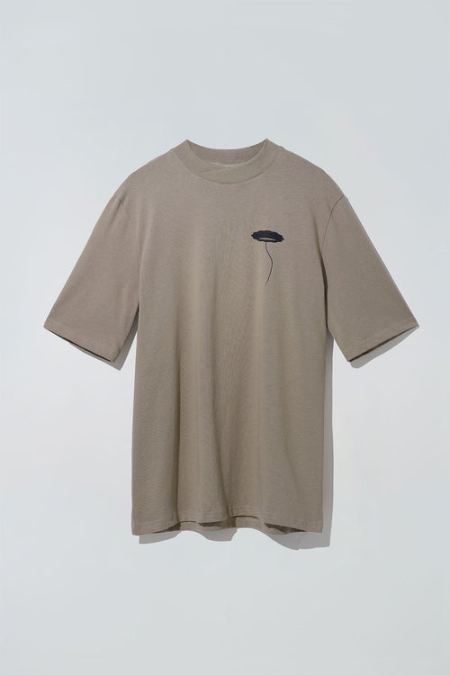 Brown rounded neck t-shirt with a silk screen print of a flower on the chest.