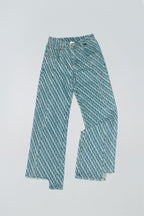 Dirty Pineapple signature patterned denim pants straight fit over white background