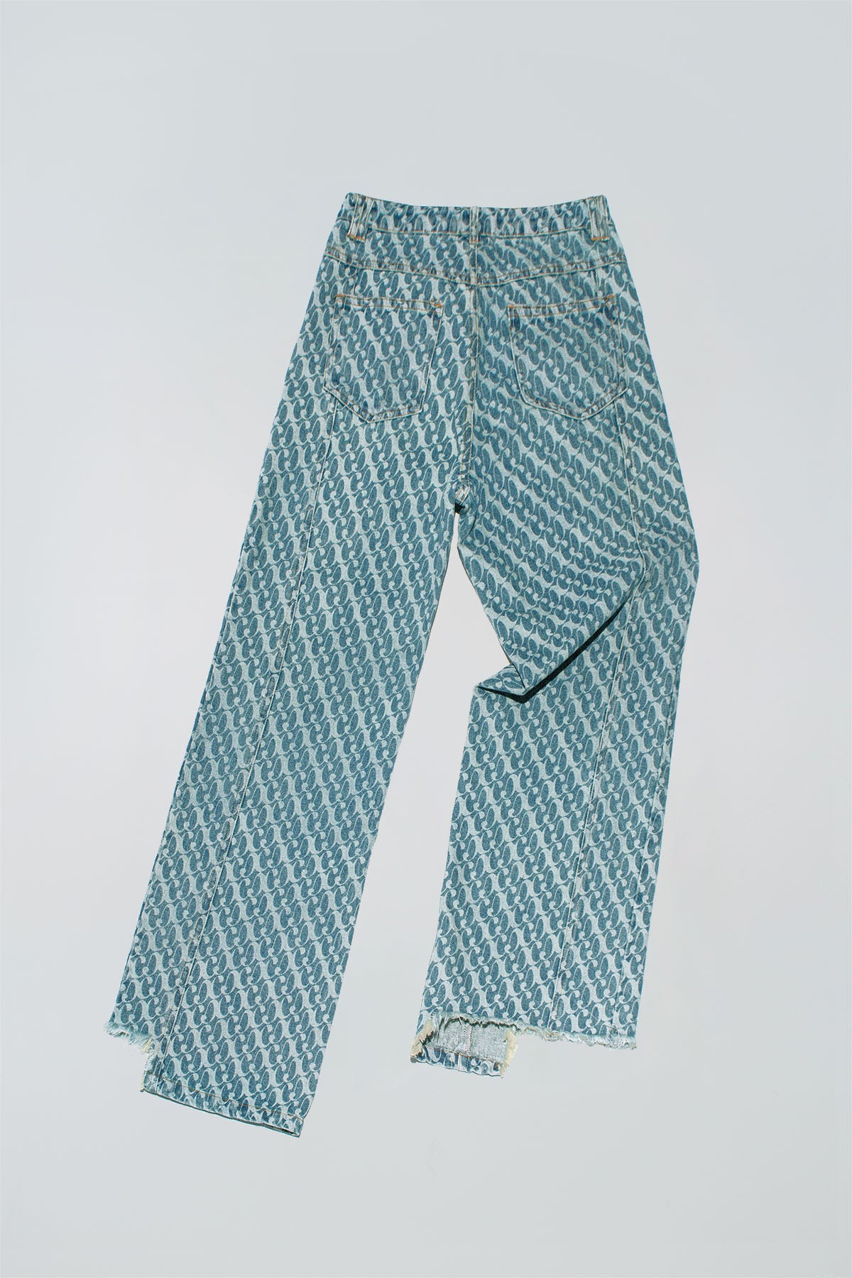 Dirty Pineapple signature patterned denim pants straight fit over white background